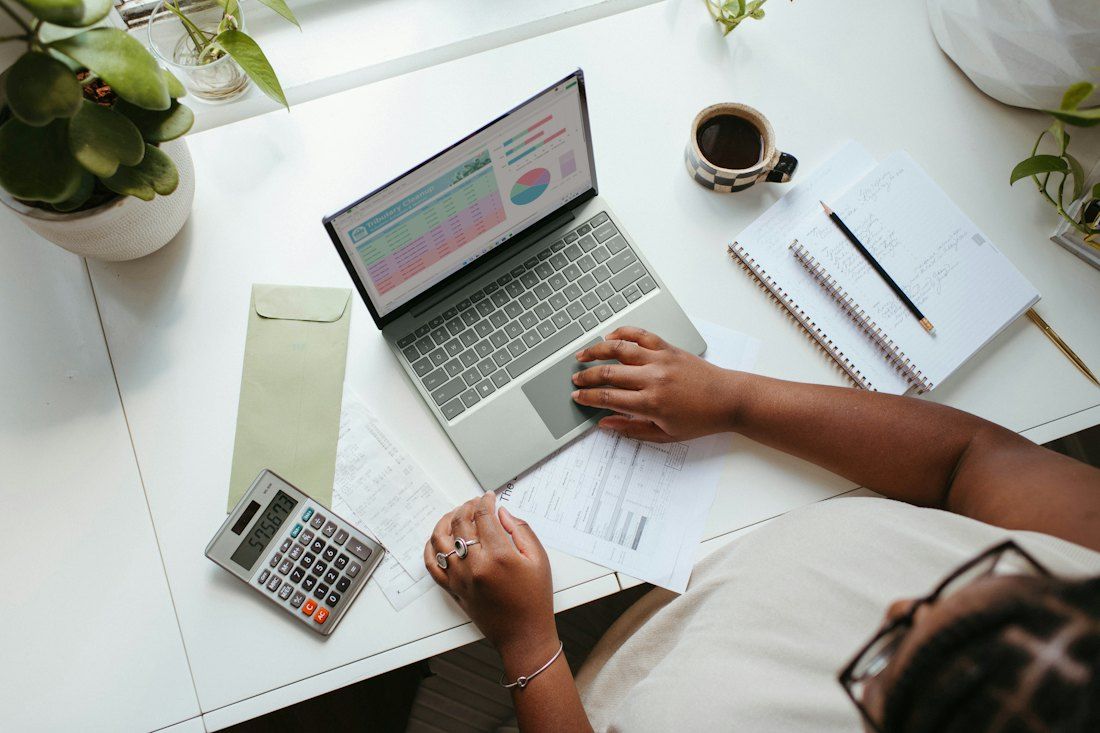 Analyst working through figures at a desk