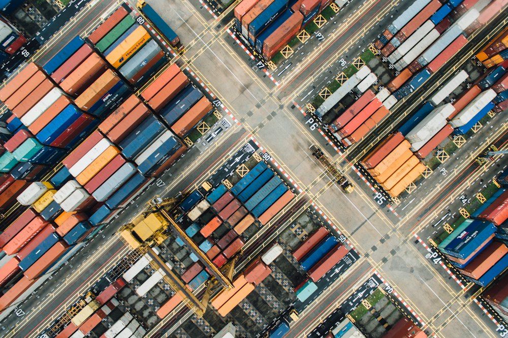 Aerial view of shipping containers in a port yard